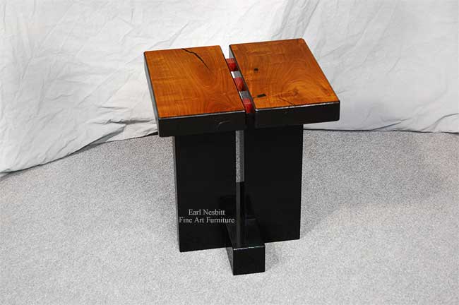 unique end table front view showing solid mesquite top and ebonized ash legs with purpleheart pegs in center split